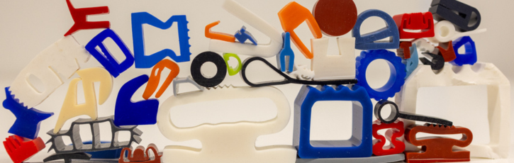 A variety of brightly coloured silicone rubber extrusion samples in different shapes and profiles, showcasing the versatility of food grade silicone