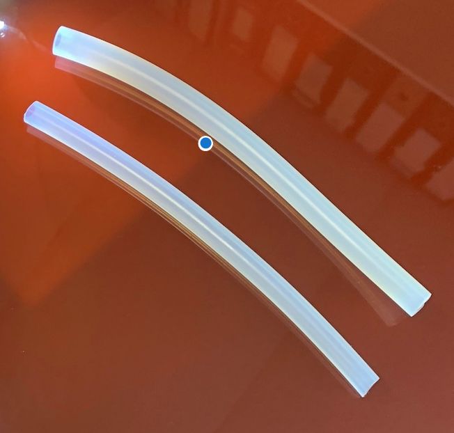  Clear silicone rubber tubing showing how a small amount of ultramarine blue pigment can be added during production to offset yellowing and maintain a clean translucent finish. 