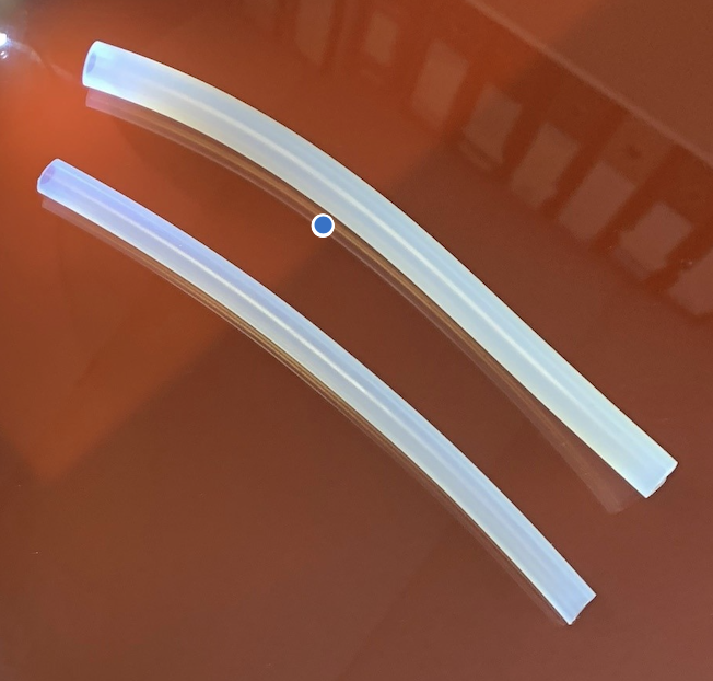  Clear silicone rubber tubing showing how a small amount of ultramarine blue pigment can be added during production to offset yellowing and maintain a clean translucent finish. 