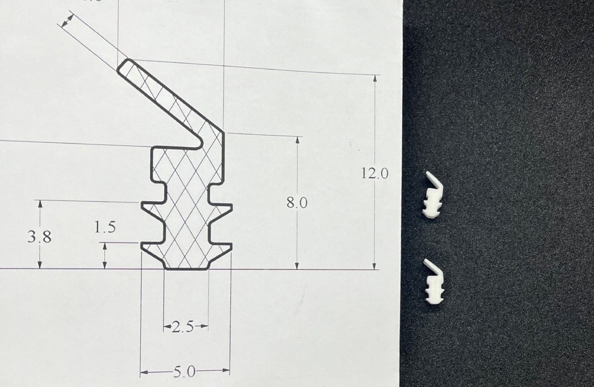 Image shows a manufactured silicone rubber lip seal next to a technical drawing